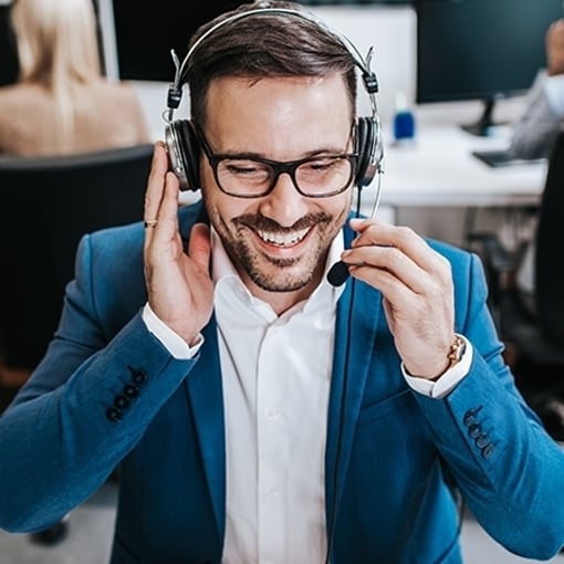 Call service work Handsome male customer service agent working in call center office as a telemarketer.