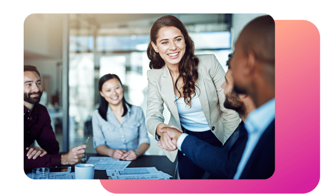 Become a Vonage Partner Image of group of people meeting in an office conference room